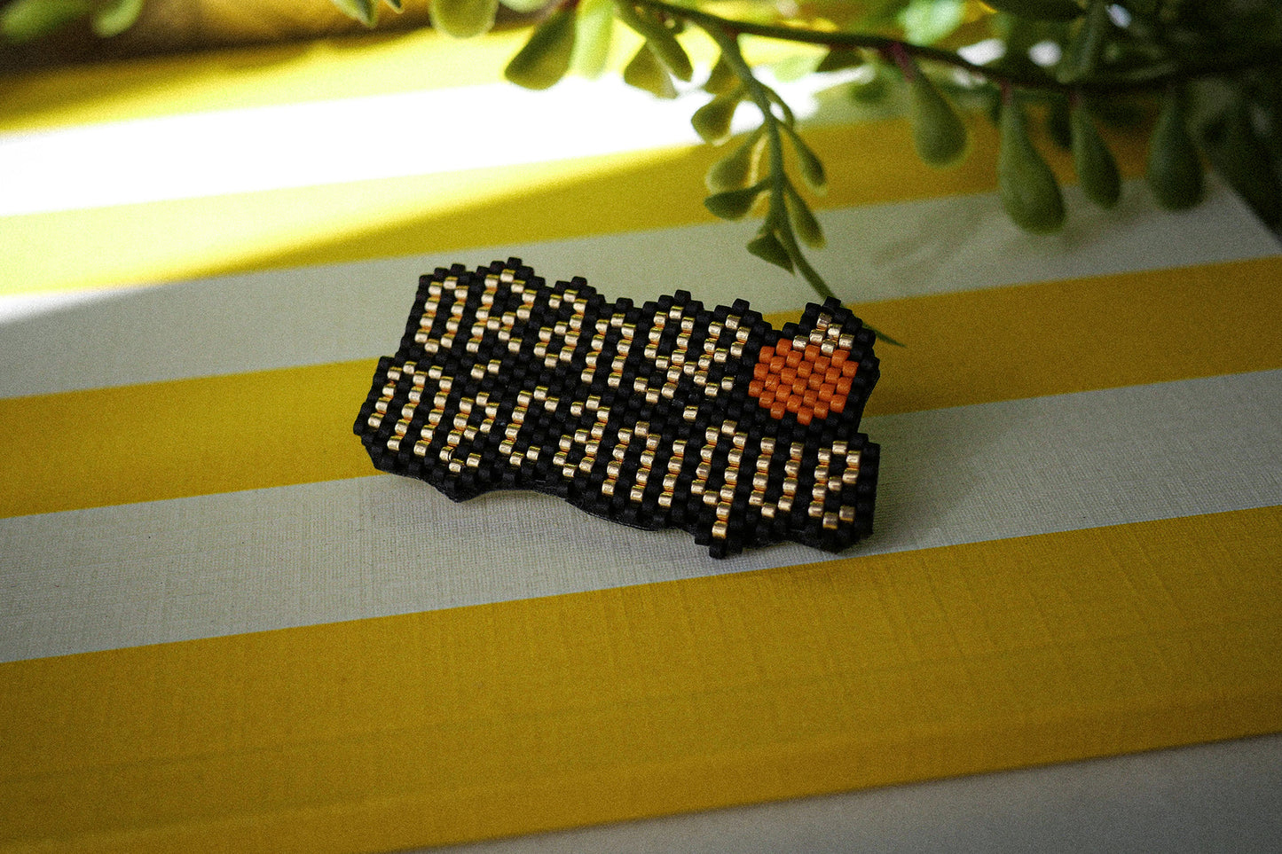 Broche Orange Mécanique