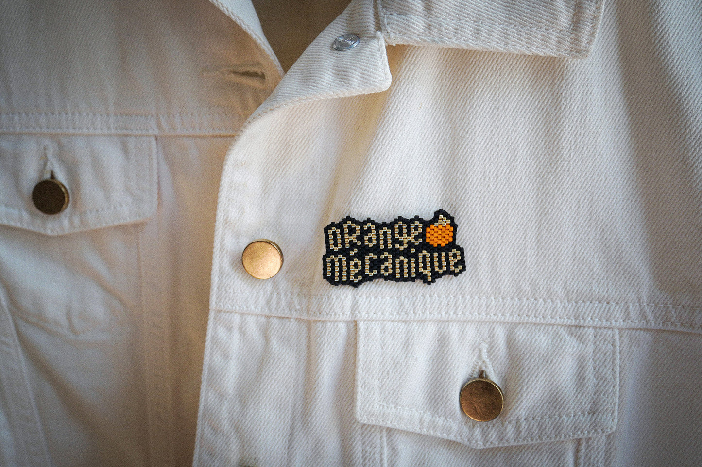Broche Orange Mécanique