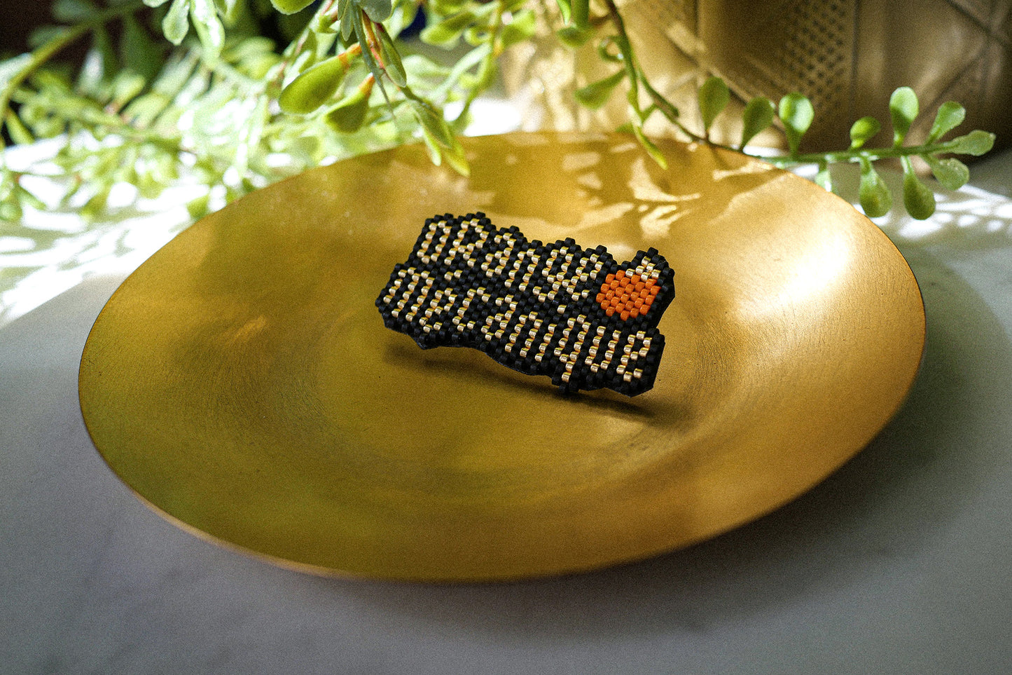 Broche Orange Mécanique