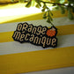 Broche Orange Mécanique